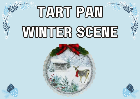 The image shows a tart pan that has been turned into a winter scene. It shows a cottage and reindeer in the snow. 